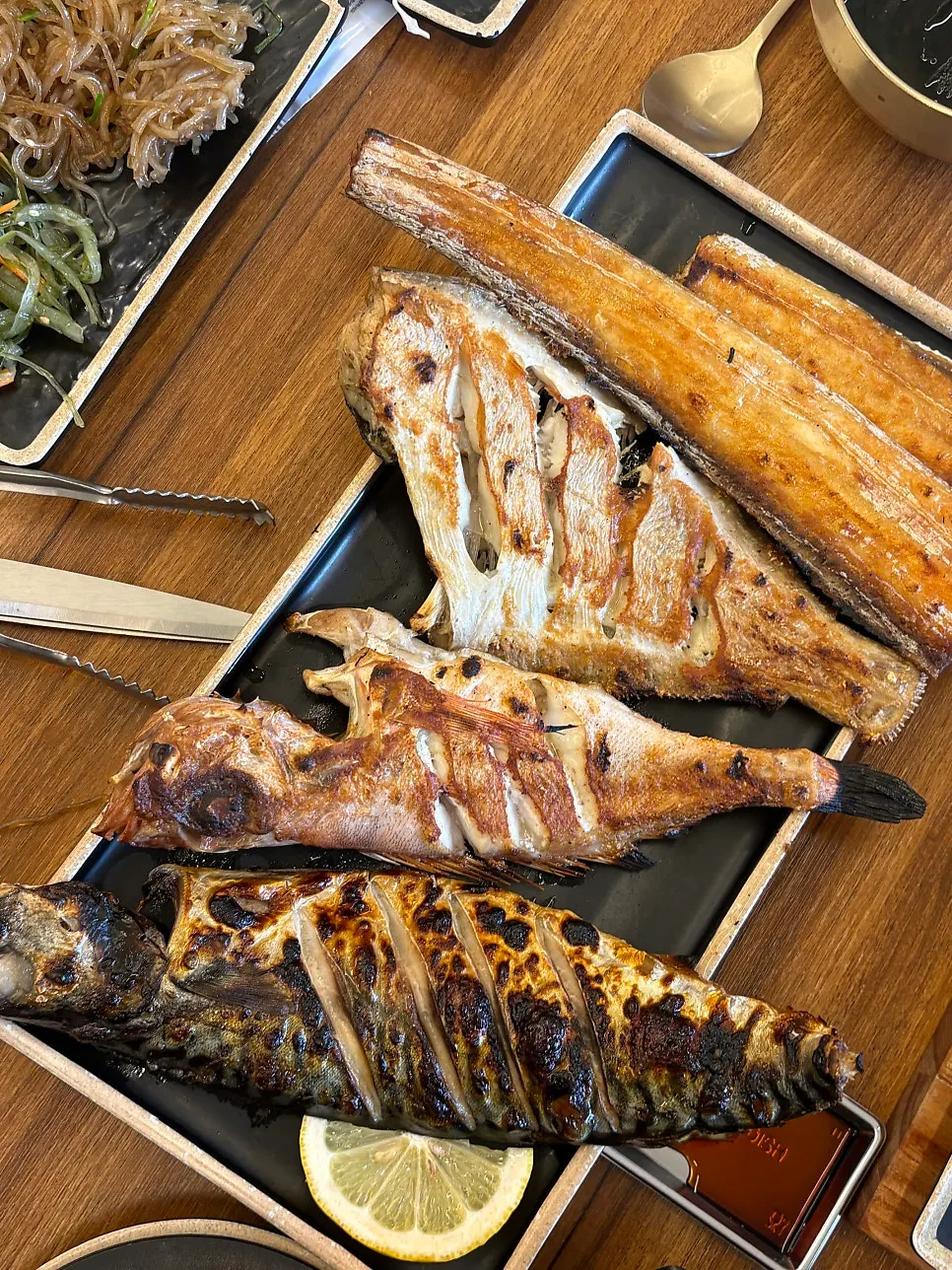 A large piece of grilled mackerel