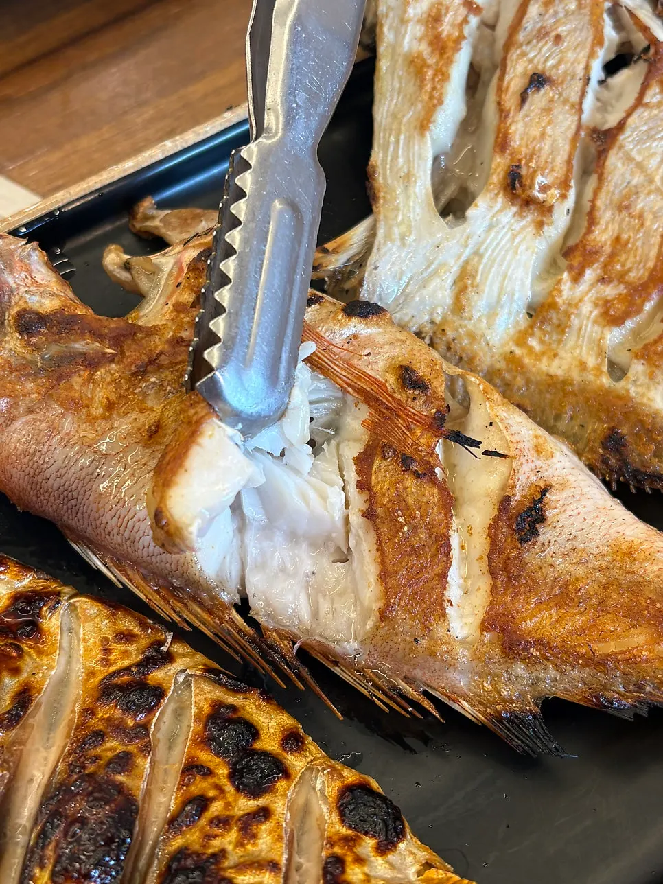 Plump, well-cooked fish flesh from Guigo