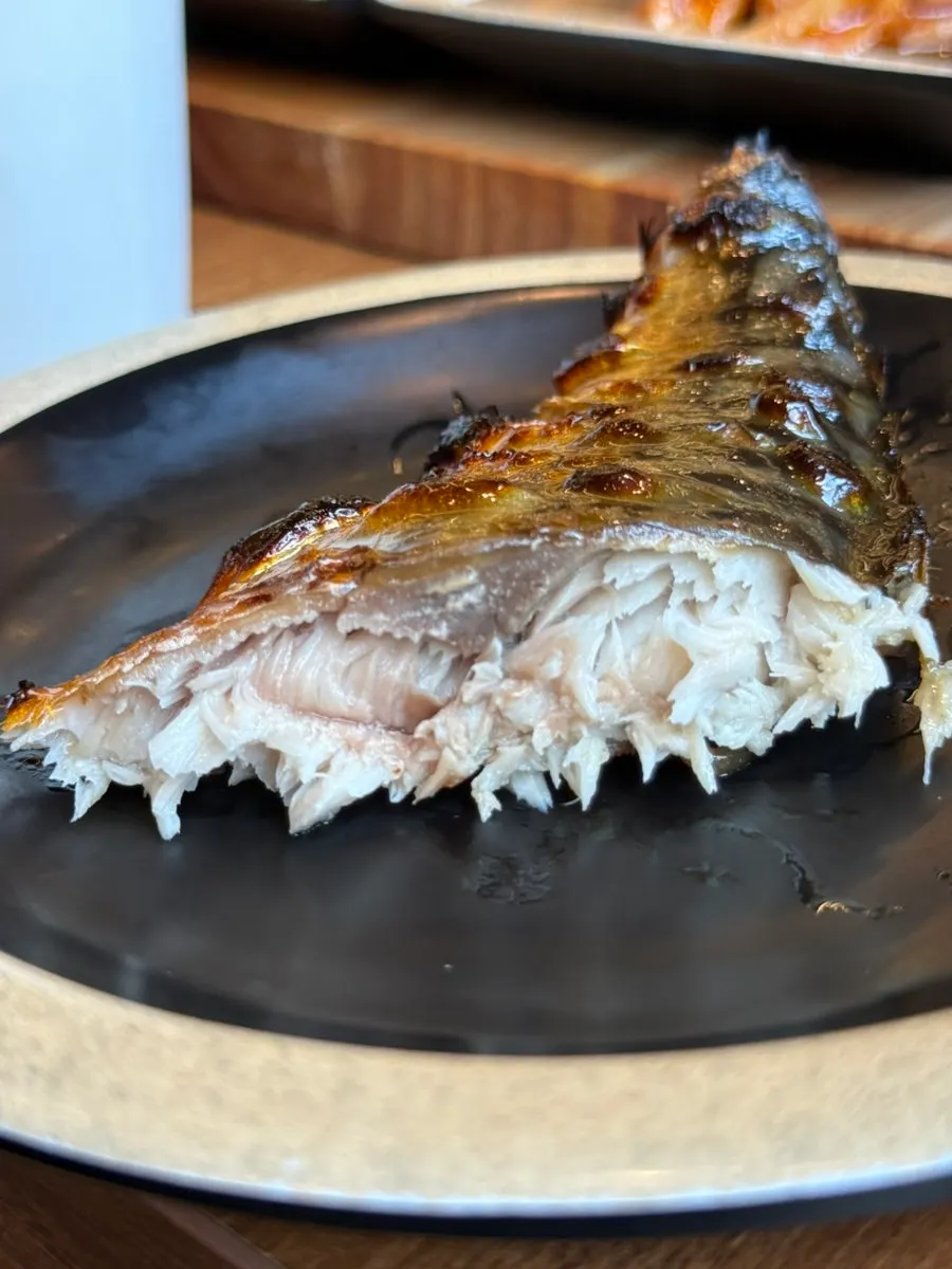Close-up of flesh from a whole-cleaned, aged grilled mackerel