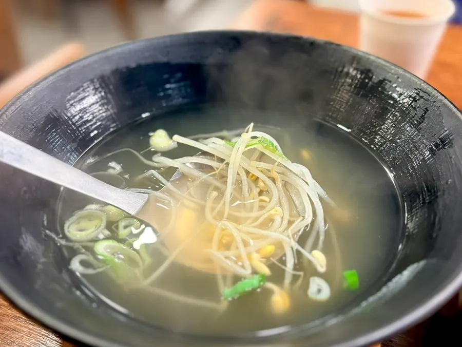 Basic table setting with wrap vegetables and warm bean sprout soup