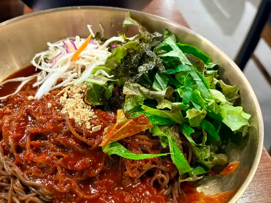 A bowl of tangy-sauced makguksu noodles