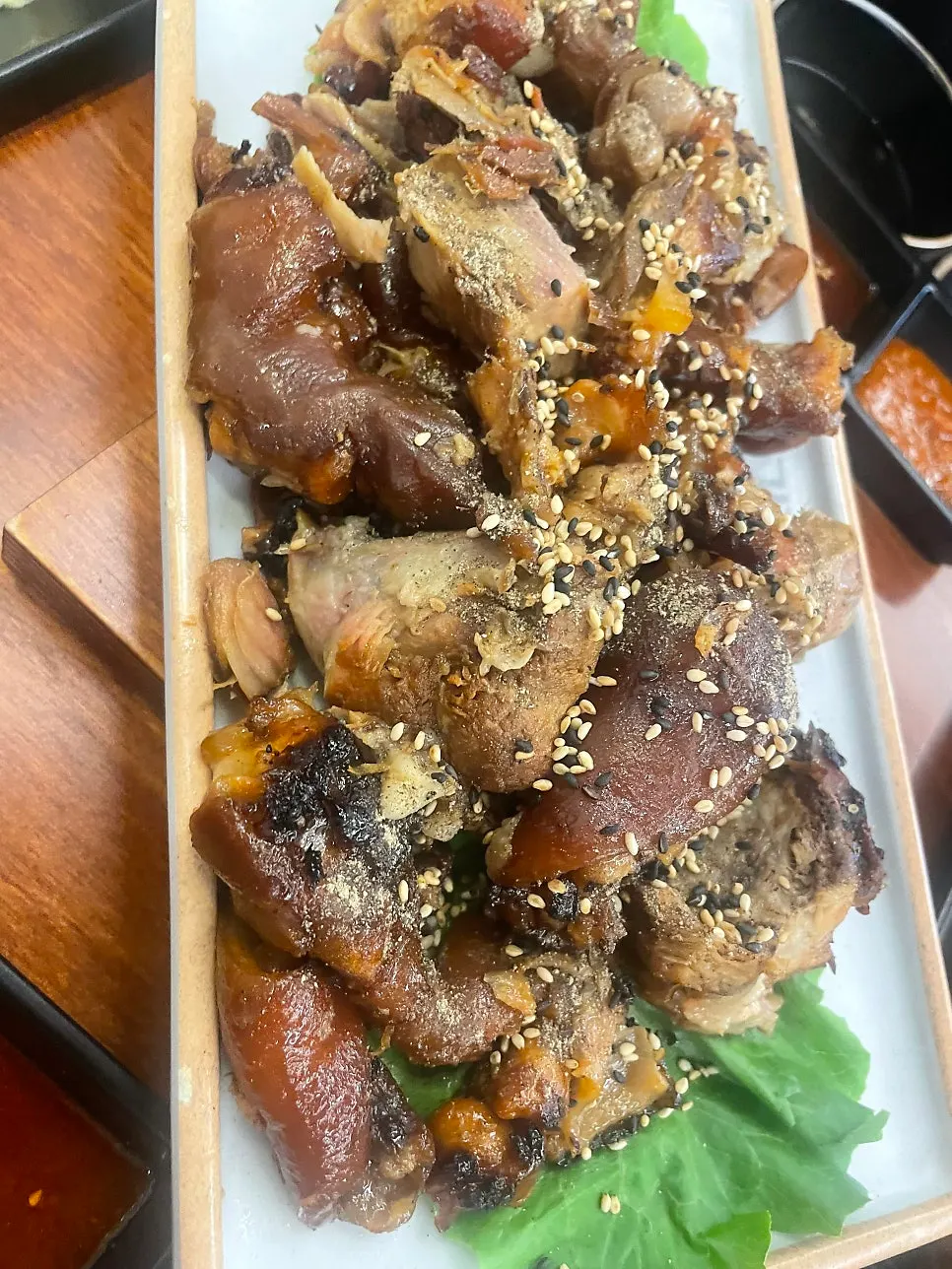 Plate of charcoal-grilled jokbal with smoky char
