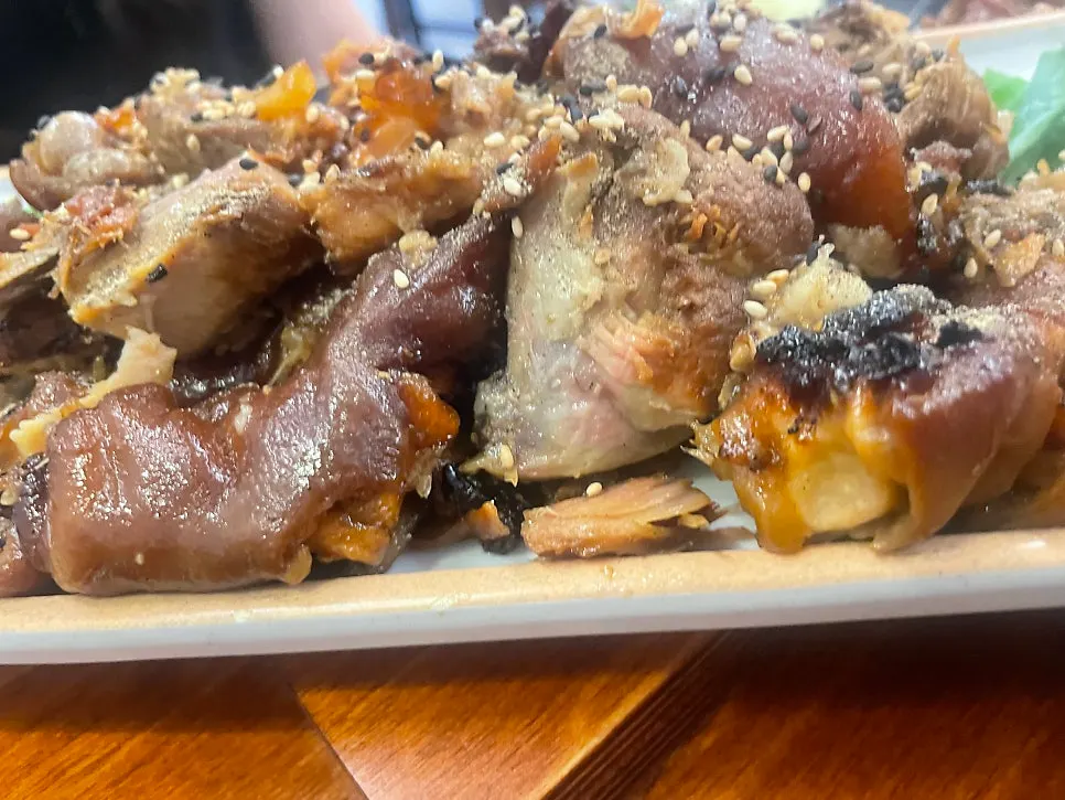 Close-up of a piece of charcoal-grilled jokbal