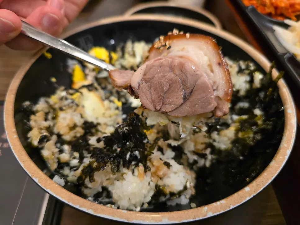 A spoonful of glossy, well-mixed soy egg rice