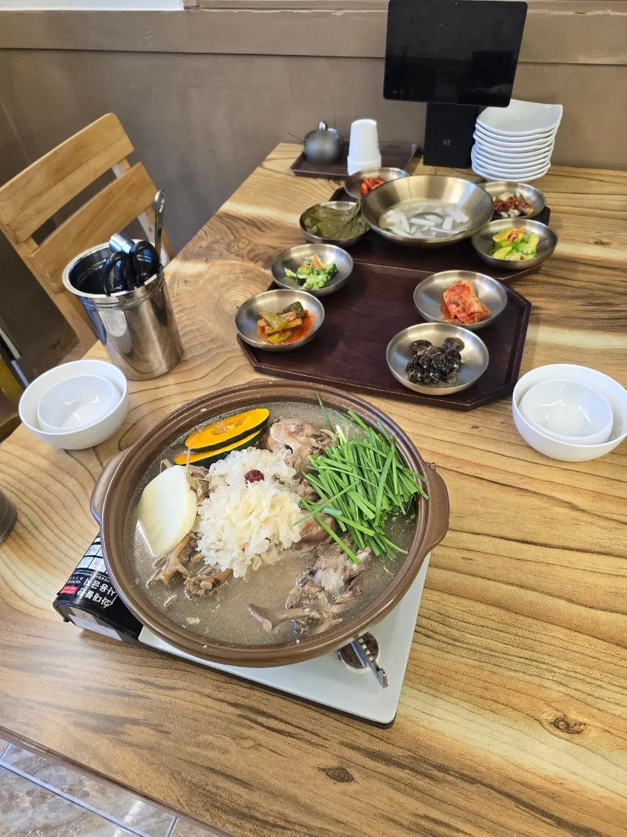 Guil Baeksuk menu board listing hwangchil chicken baeksuk