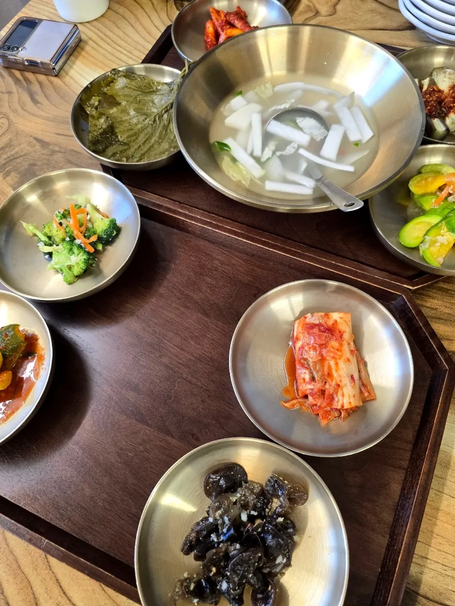 Side dishes served in brass bowls