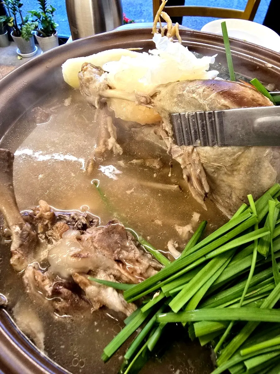 Hwangchil chicken baeksuk topped with white wood ear mushrooms and sweet pumpkin