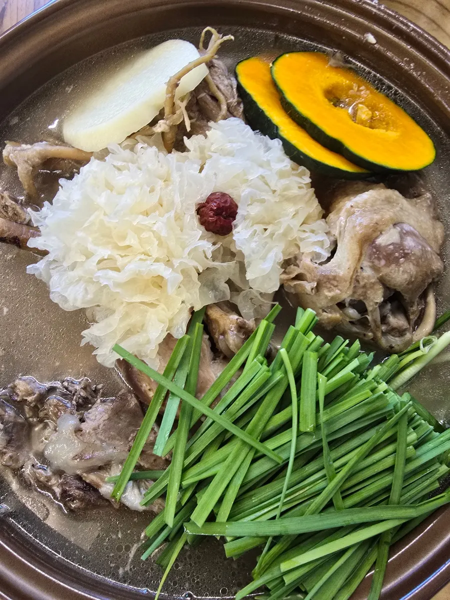 Chicken baeksuk dinner shared by two people