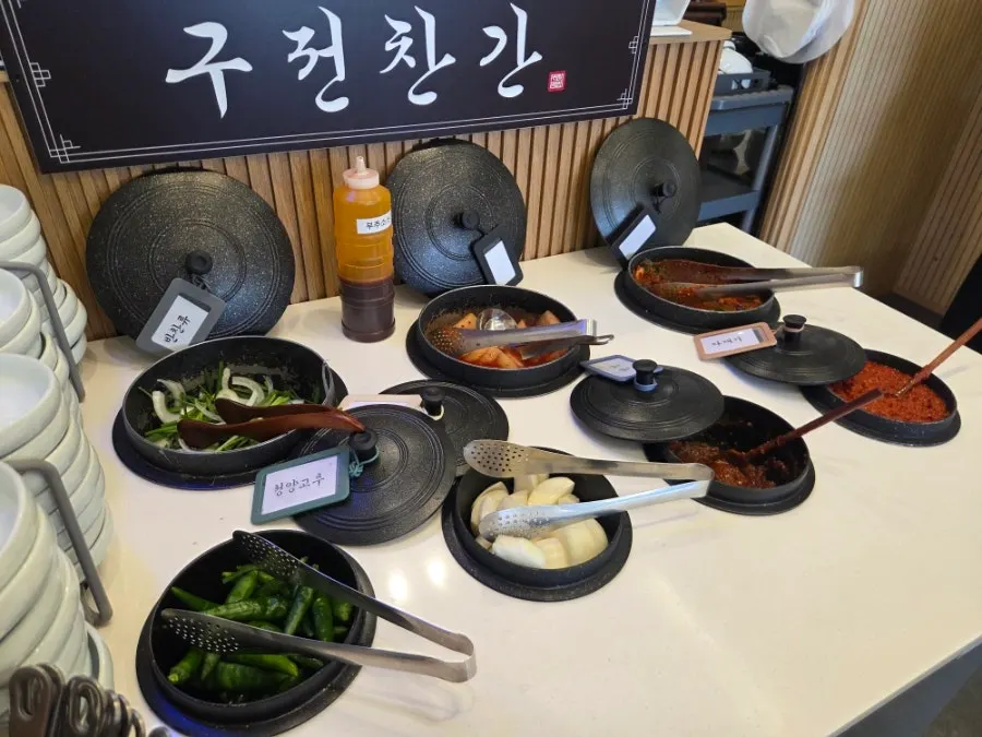 Self-serve side dish bar in cauldron-shaped bowls