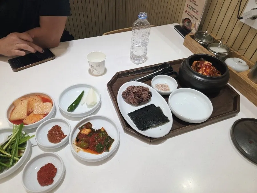 Sticky rice and salted shrimp served as standard sides