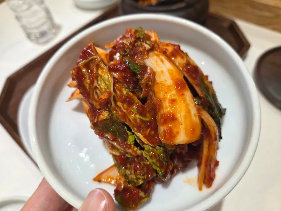 A plate of spicy halmaep cabbage kimchi
