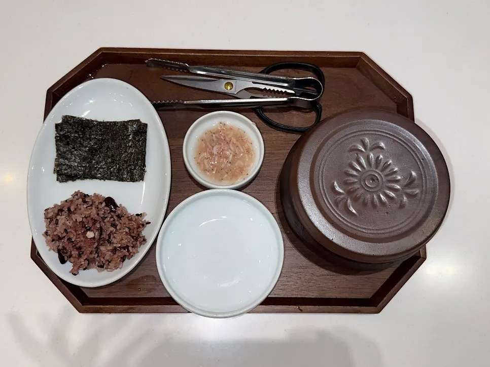 Two bowls of gukbap with the basic side spread