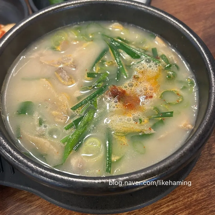 A bowl of pork gukbap with milky broth