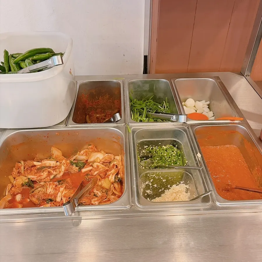 Self-serve bar with a rice cooker full of chapssal sundae