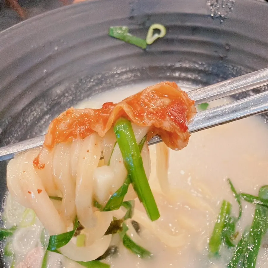 Gogi guksu served alongside gukbap on the table
