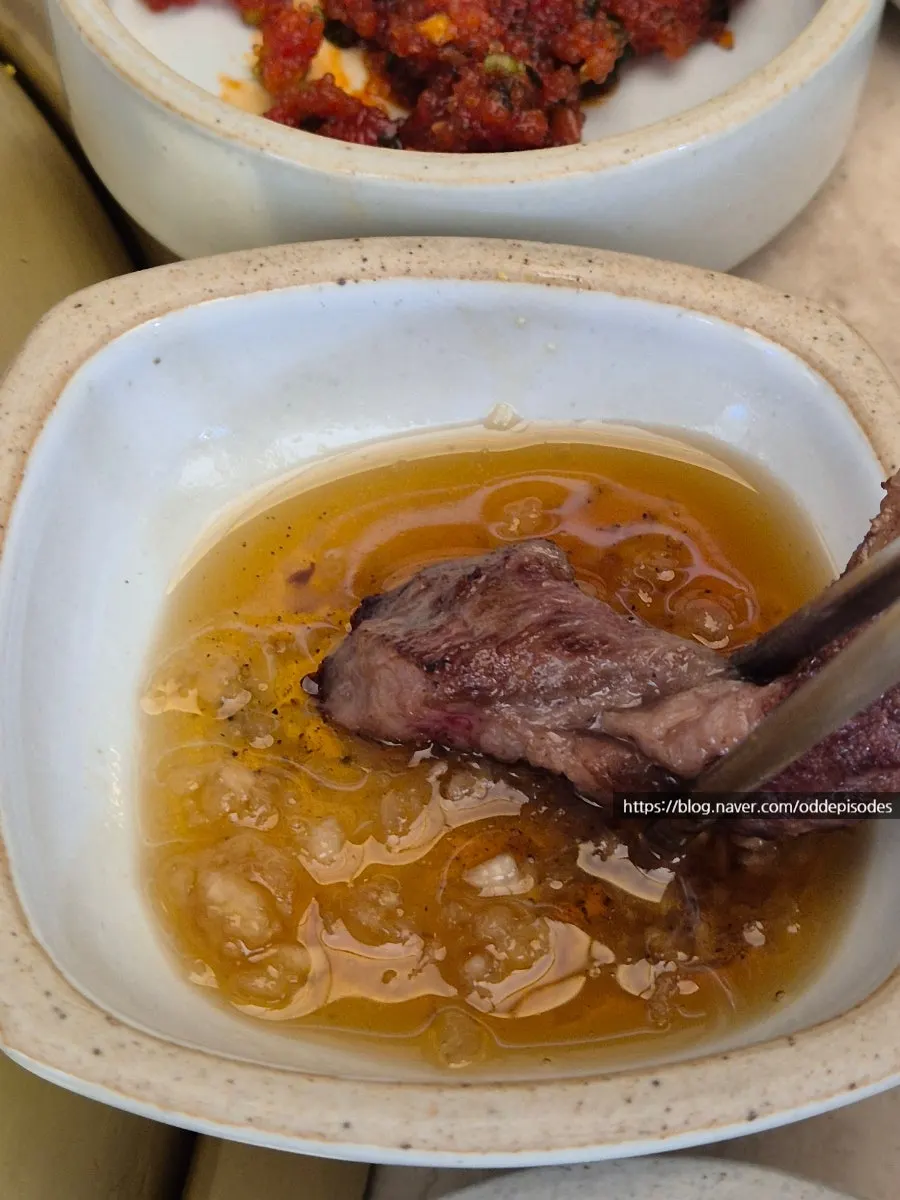 A piece of rib-eye with salt and wasabi