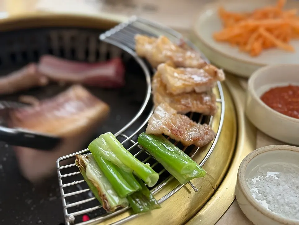 Bakpo fresh ribs grilling over charcoal