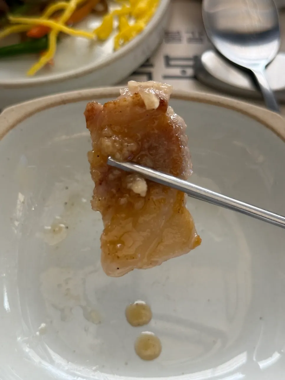 A piece of bakpo fresh rib dipped in salt