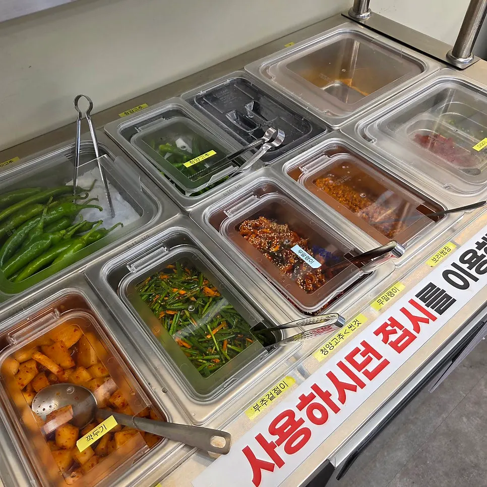 Side dishes and rice pot at the self-serve bar