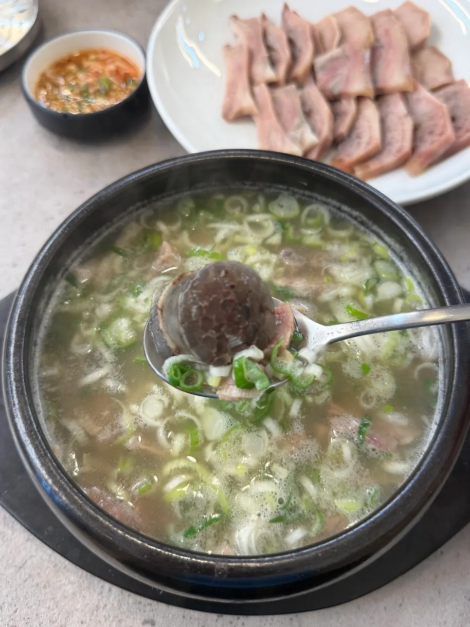 A bowl of sundaeguk packed with sundae and meat