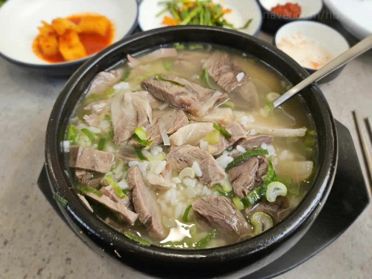 Full table spread of clear-broth sundaeguk at Gukdam Sundaeguk Main Branch