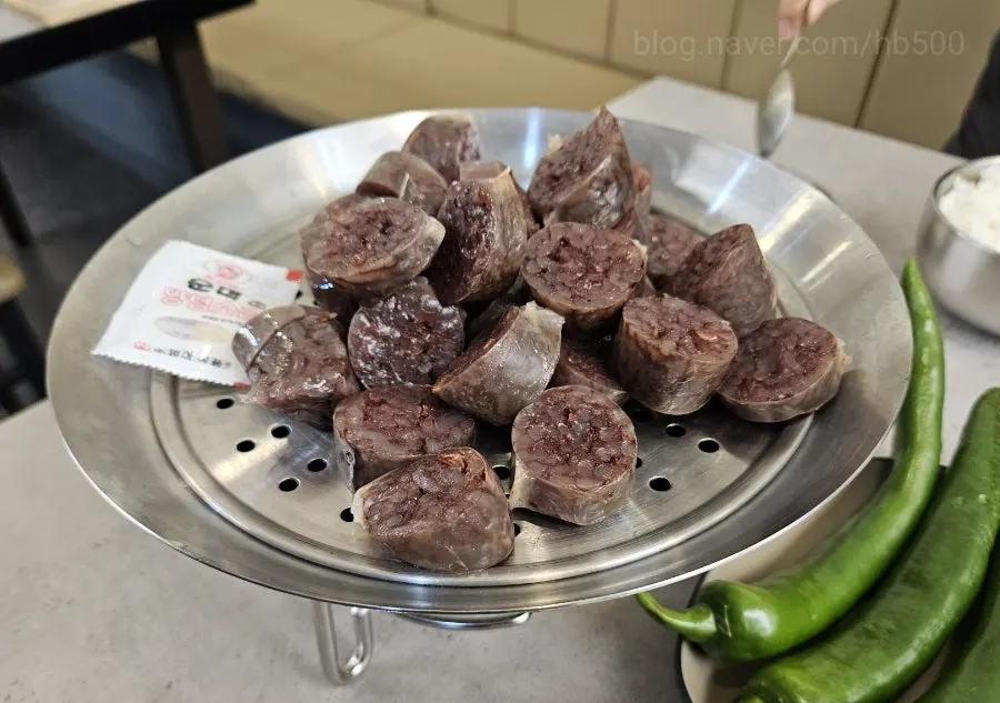 Jjal sundae served on a mini steamer over a solid-fuel warmer