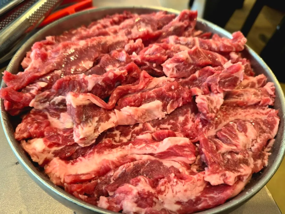 Beef fresh galbi and pork fresh galbi table setting at Gukgojip