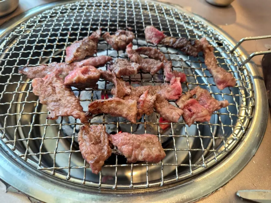 Fresh galbi grilling on the grill plate