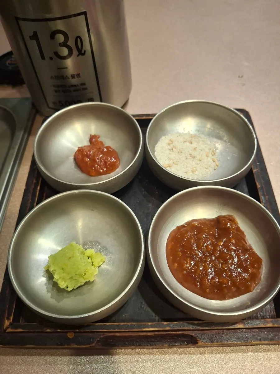 Ssamjang, salt, wasabi, and other condiments for the meat