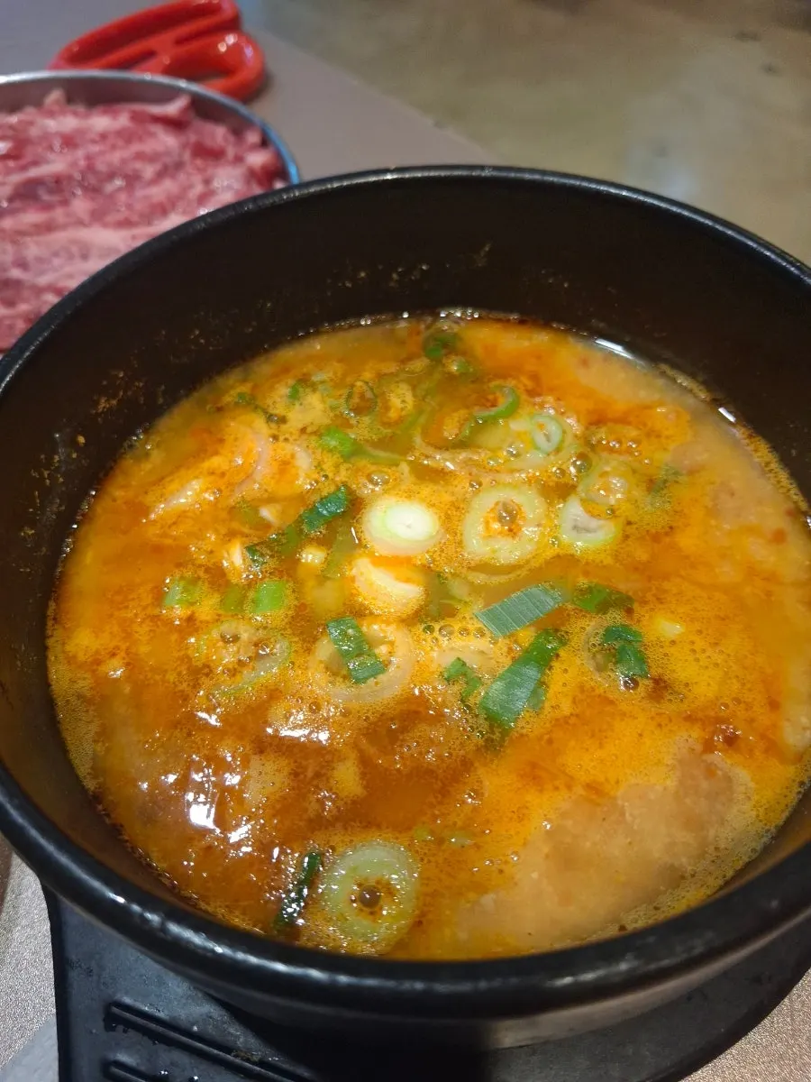Soybean pulp stew served before the meat
