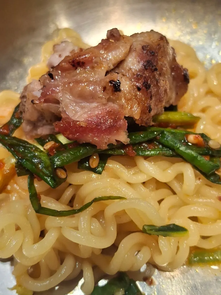 Noodles and broth in the beef bone broth ramyeon