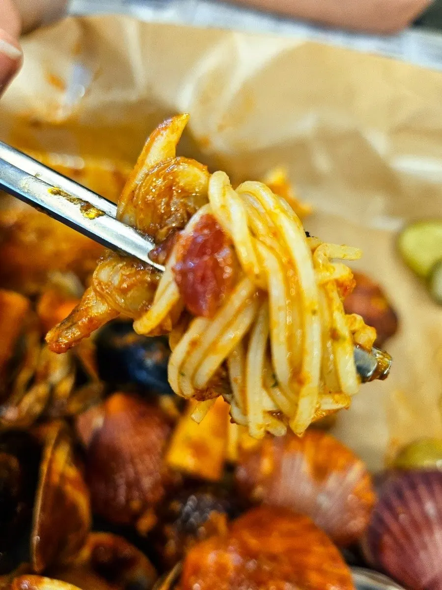 Leftover pasta on the seafood boiling plate