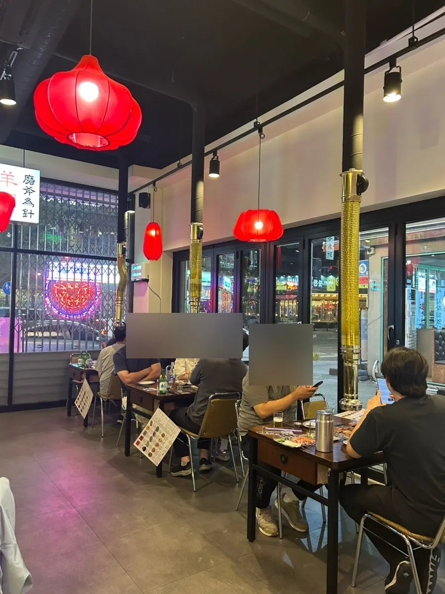 Gukje Yangyukgwan interior full of diners on a weekday evening