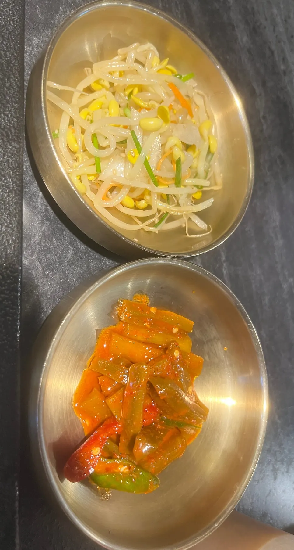 Table set with side dishes and onion strips with sauce