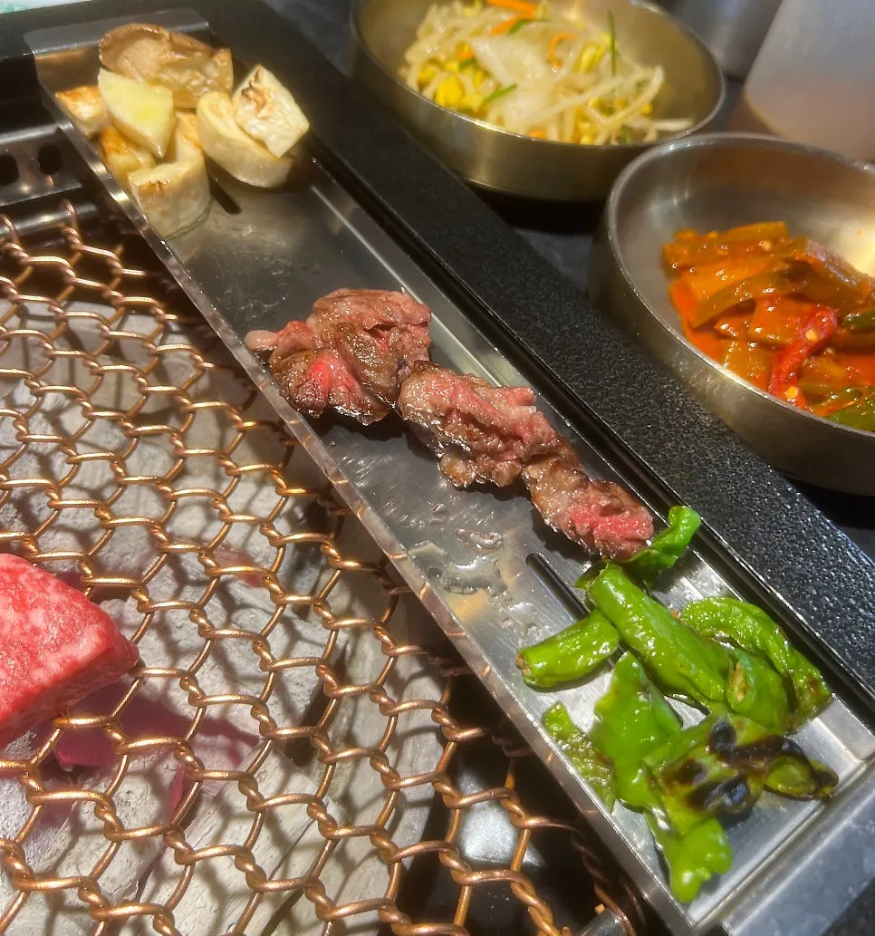 Top sirloin cut into cubes and being grilled