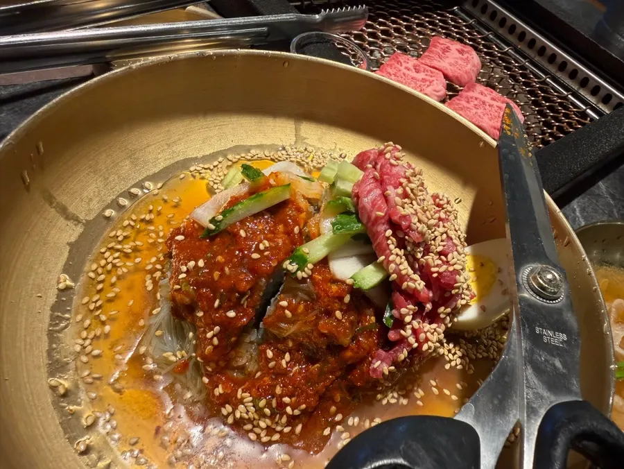 Side dishes in a brass bowl with pickled onion and radish