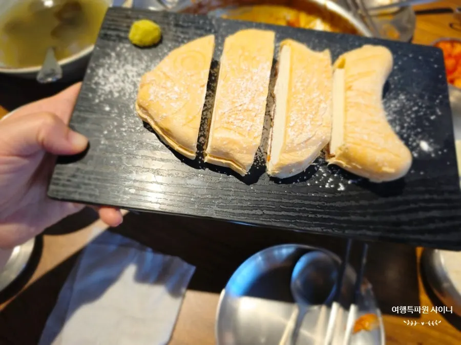 Sign for the review event offering bungeoppang sashimi