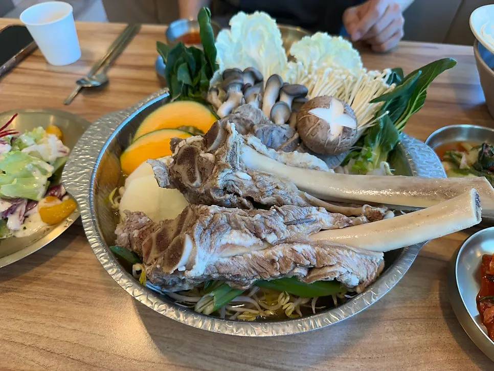Hot pot with two large rib bones on top