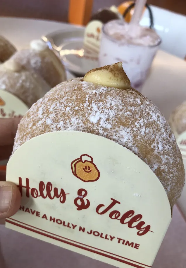 A doughnut split open to show the cream