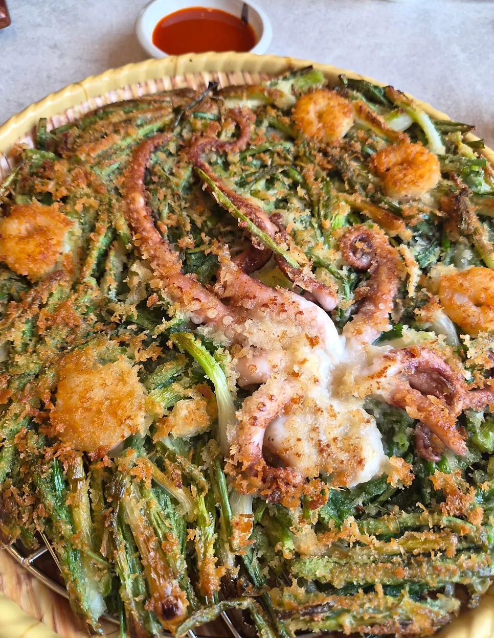 Irojeong's seafood pancake topped with a whole octopus