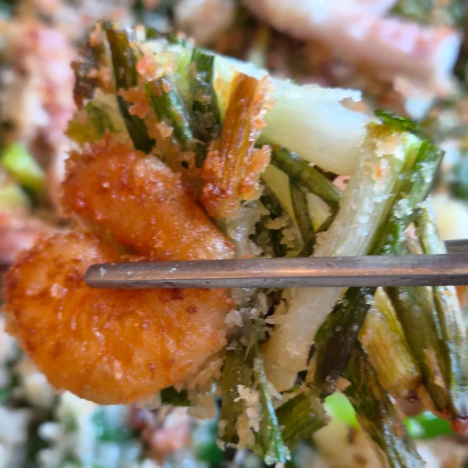 Cross-section of octopus seafood pancake packed with seafood