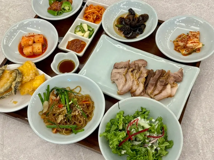 Salad, kimchi, japchae and other side dishes