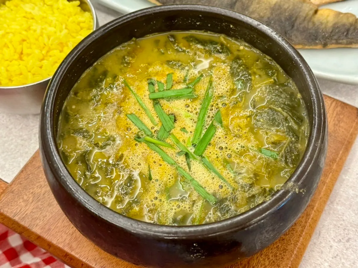 A bowl of rich sanghwang mushroom loach soup