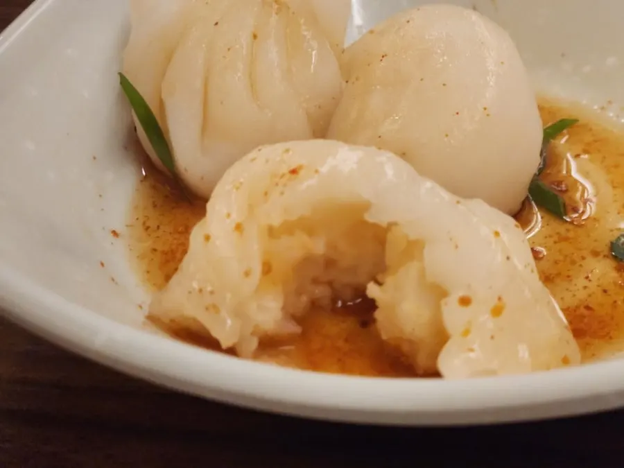 Whole shrimp dimsum cut in half showing the filling