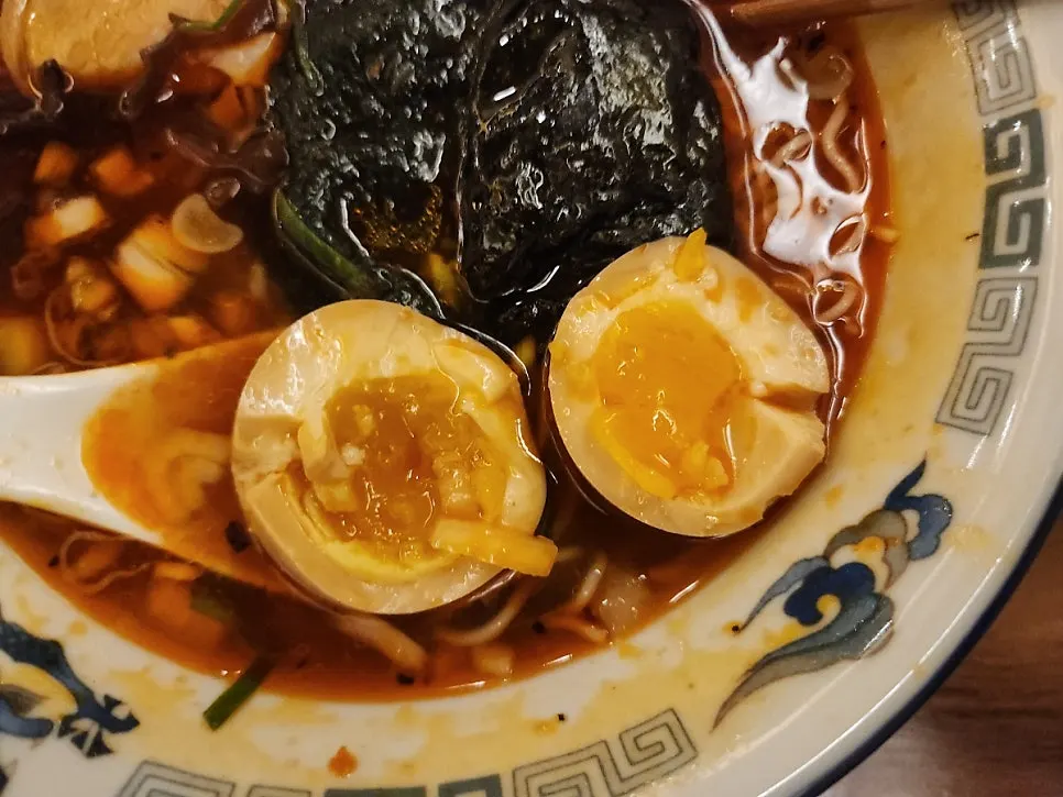 A soft-boiled ramen egg cut in half