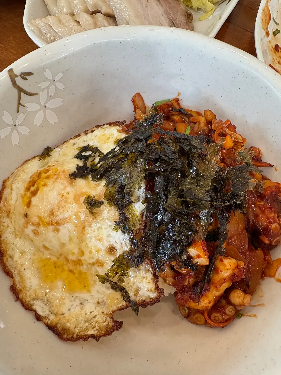 Octopus bibimbap drizzled with sesame oil