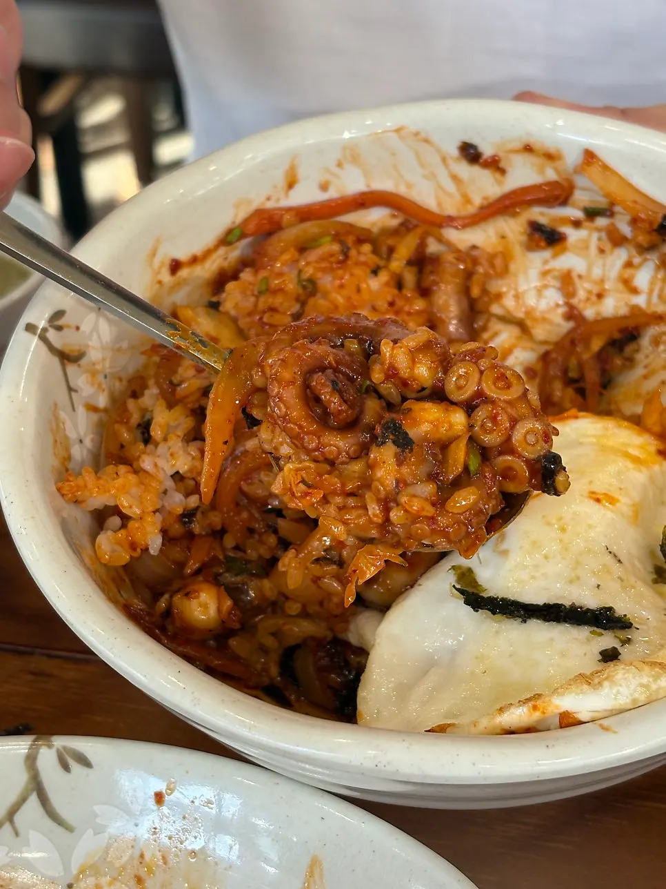 A spoonful of mixed octopus bibimbap