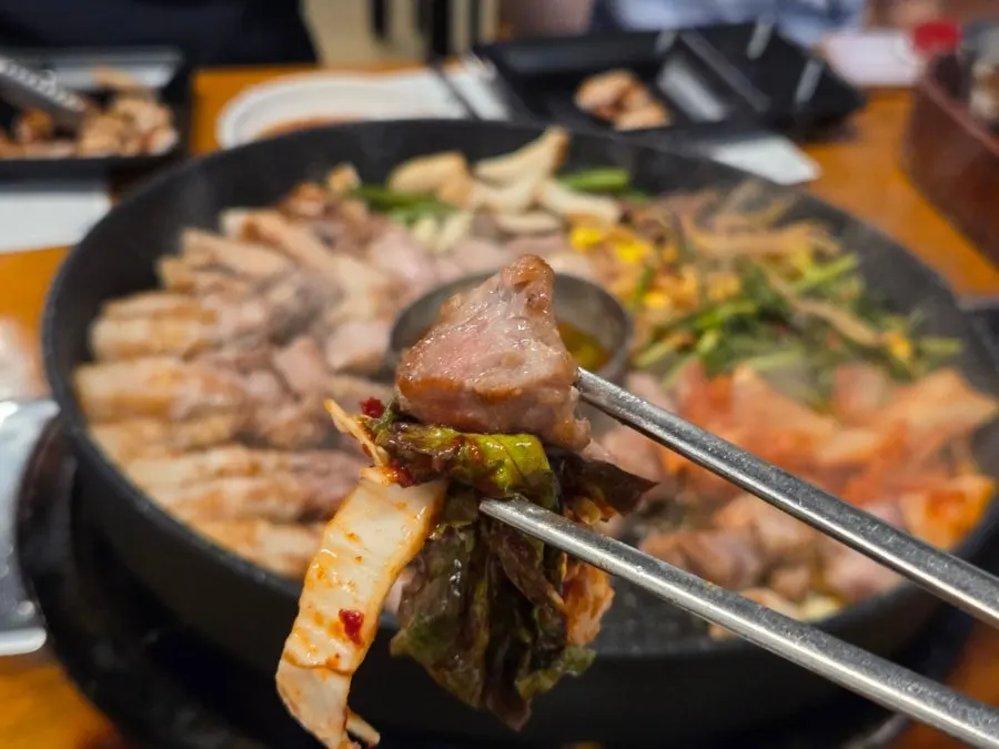 Meat and side dishes on the grill