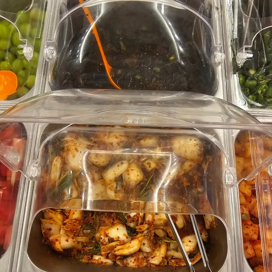 Self-serve bar with rice, minced garlic, and chili
