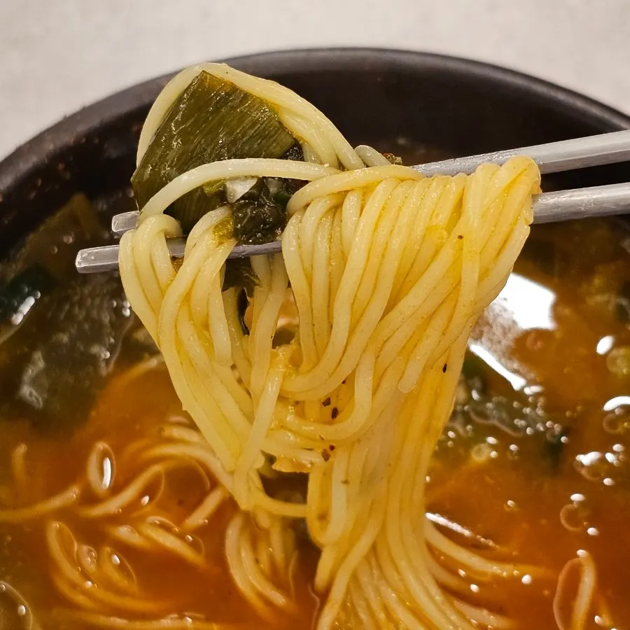 Thick loach soup served in a stone bowl